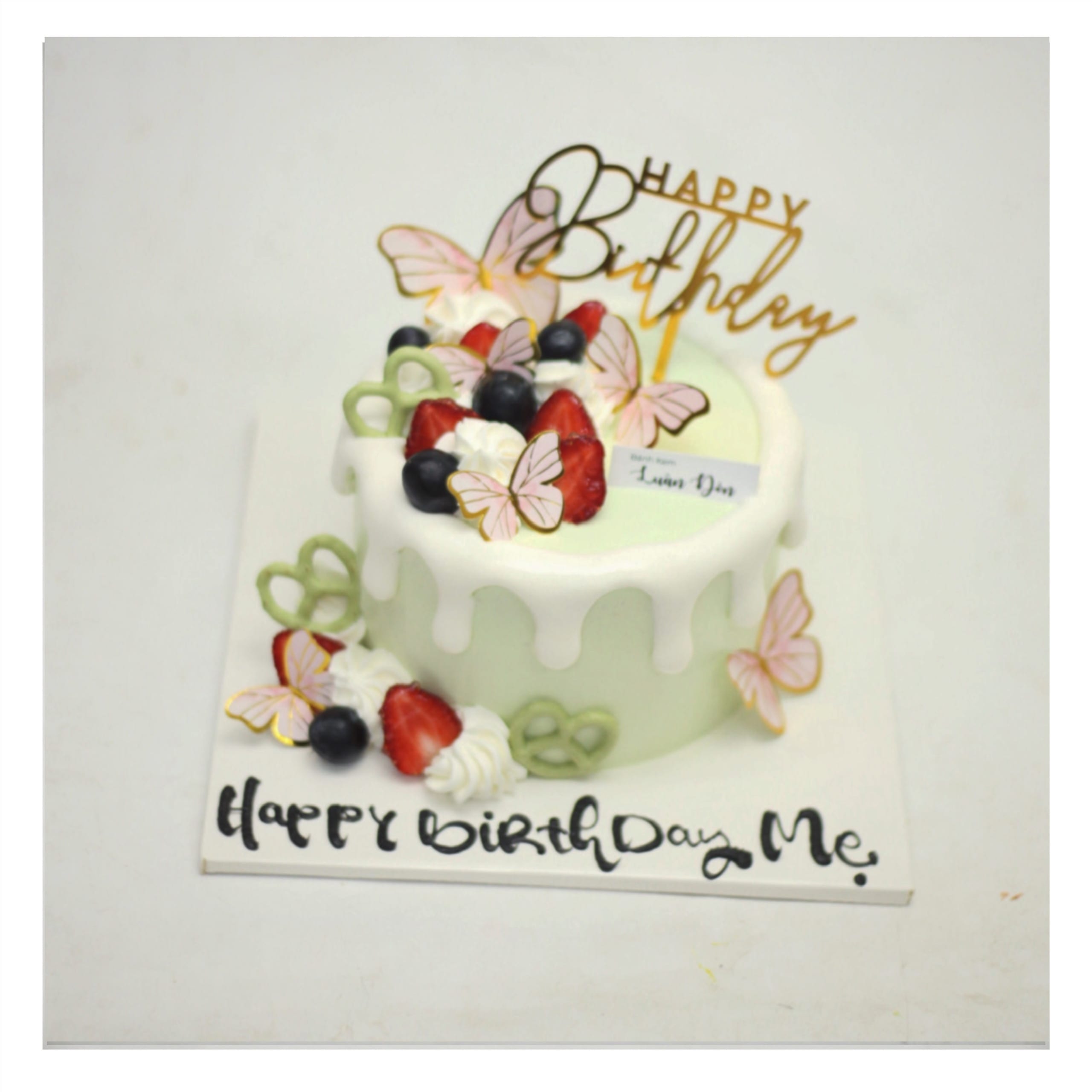 Bánh kem xanh pastel trang trí bướm xinh