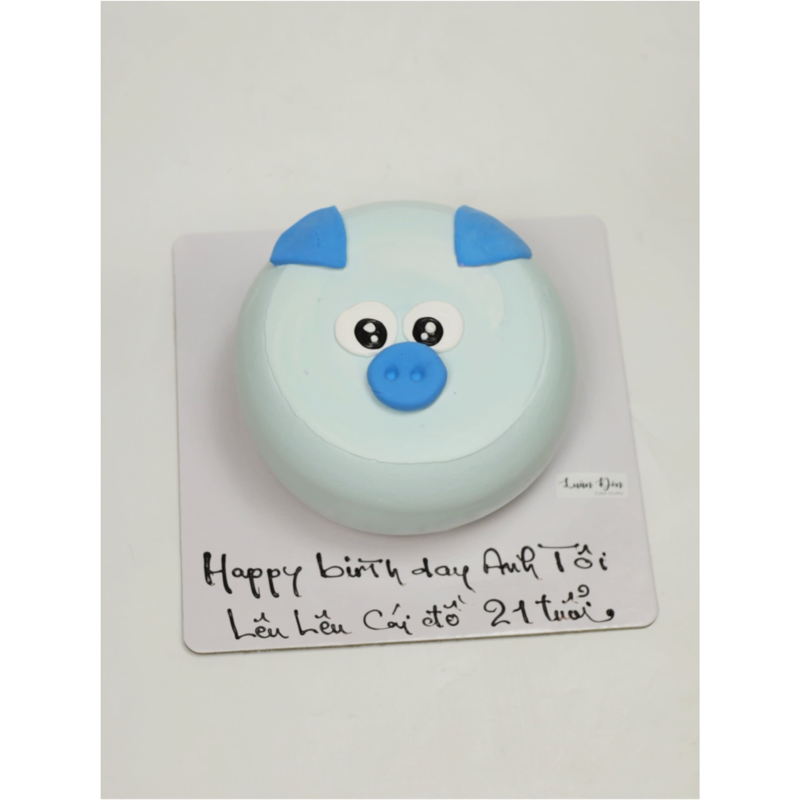 Bánh kem hình chú heo con màu xanh pastel