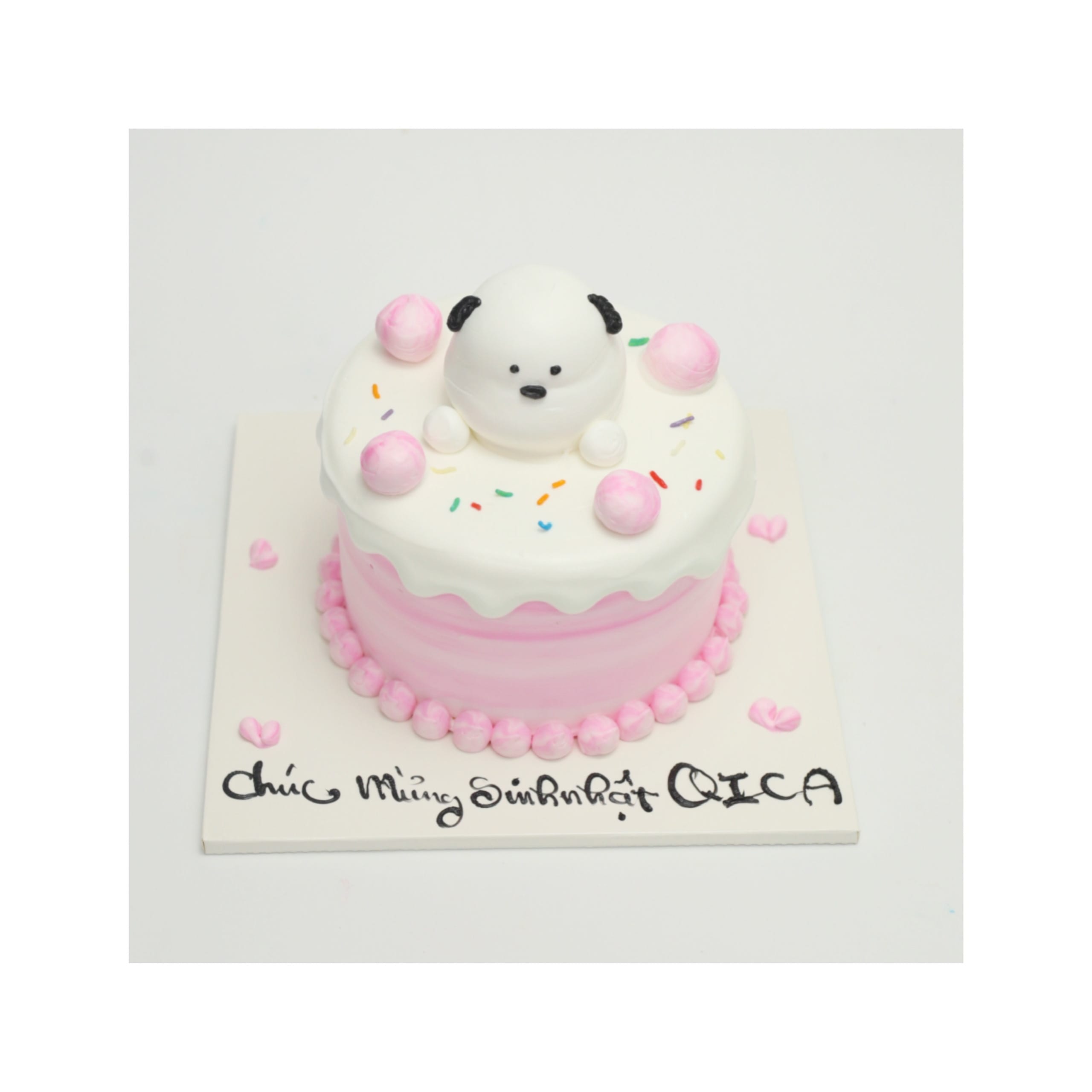 Bánh kem hồng pastel trang trí chú chó trắng