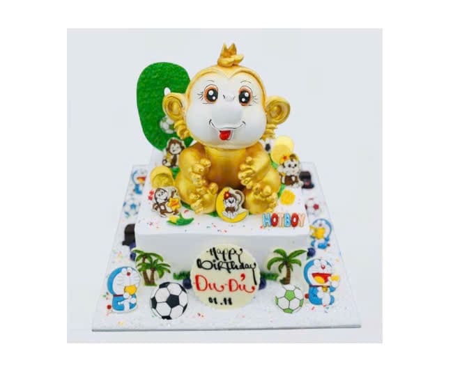 Bánh kem chú Khỉ vàng cùng họa tiết Doraemon