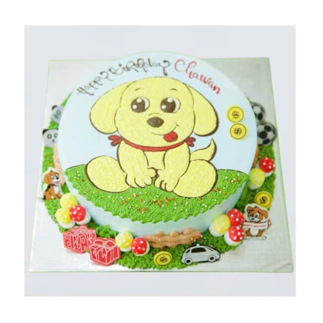 Bánh kem vẽ hình chú chó vàng trên sân cỏ