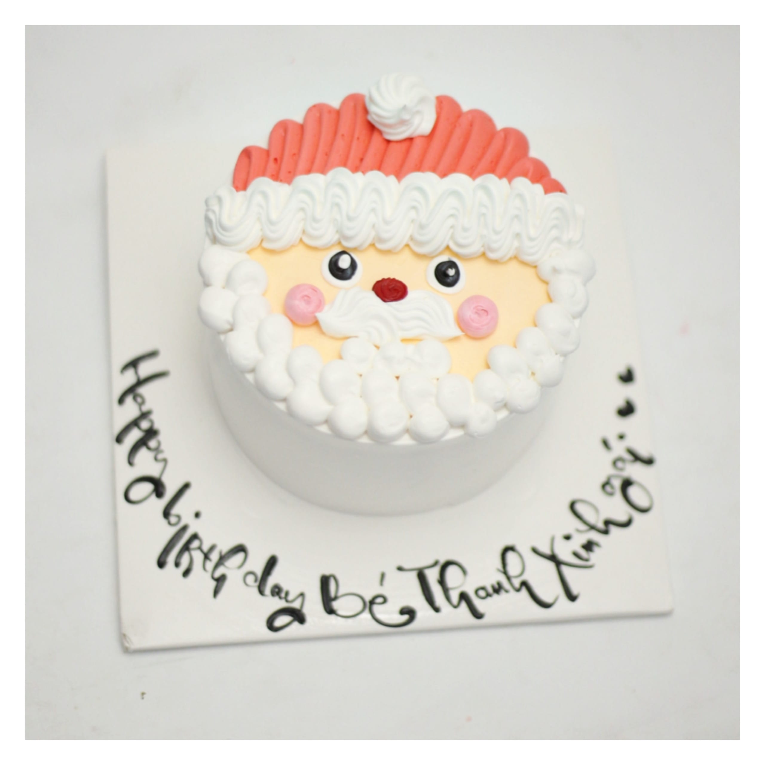 Bánh kem hình mặt ông già Noel trắng đỏ
