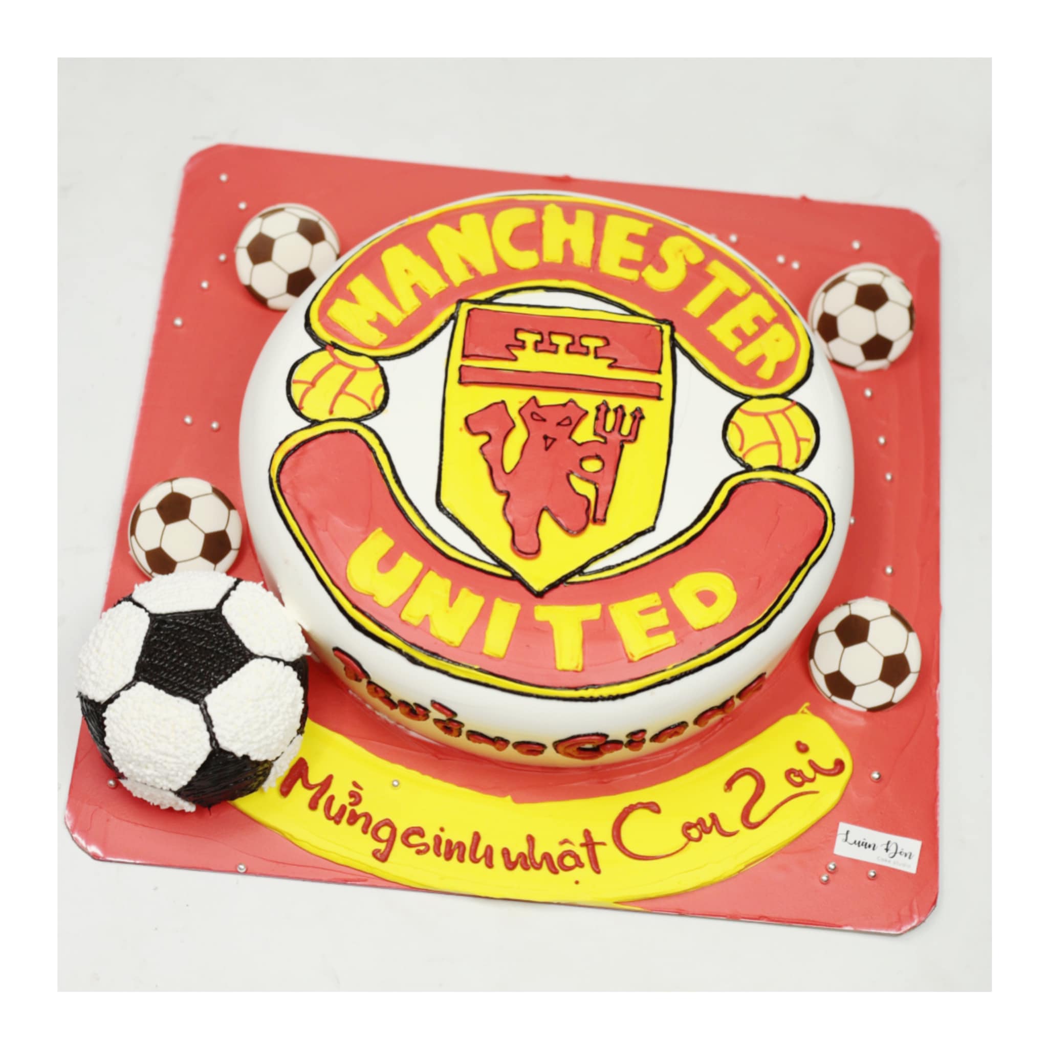 Bánh kem logo Manchester United và bóng đá