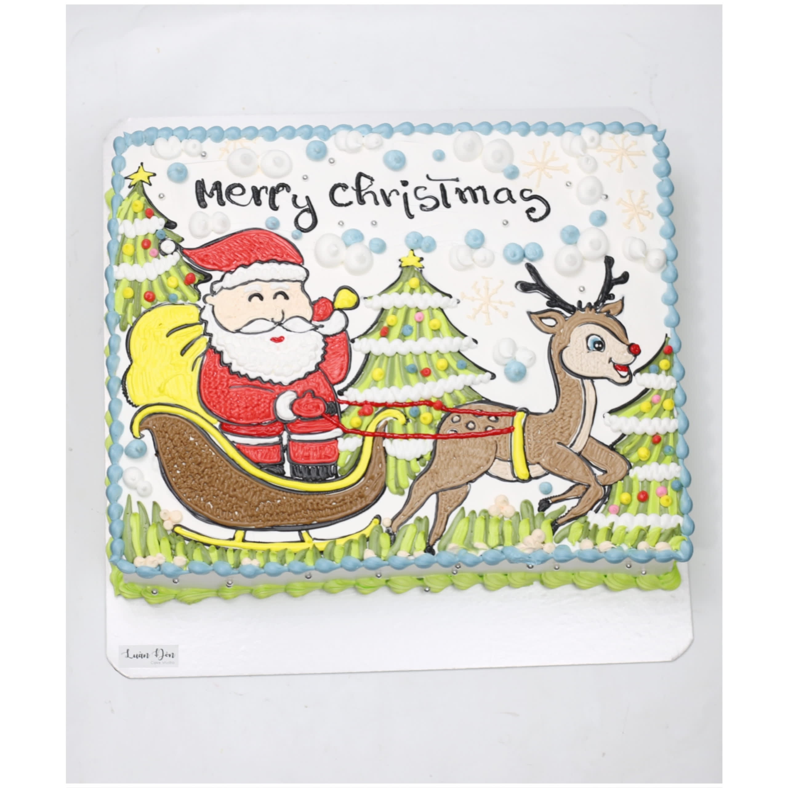 Bánh kem vẽ hình ông già Noel đi xe trượt