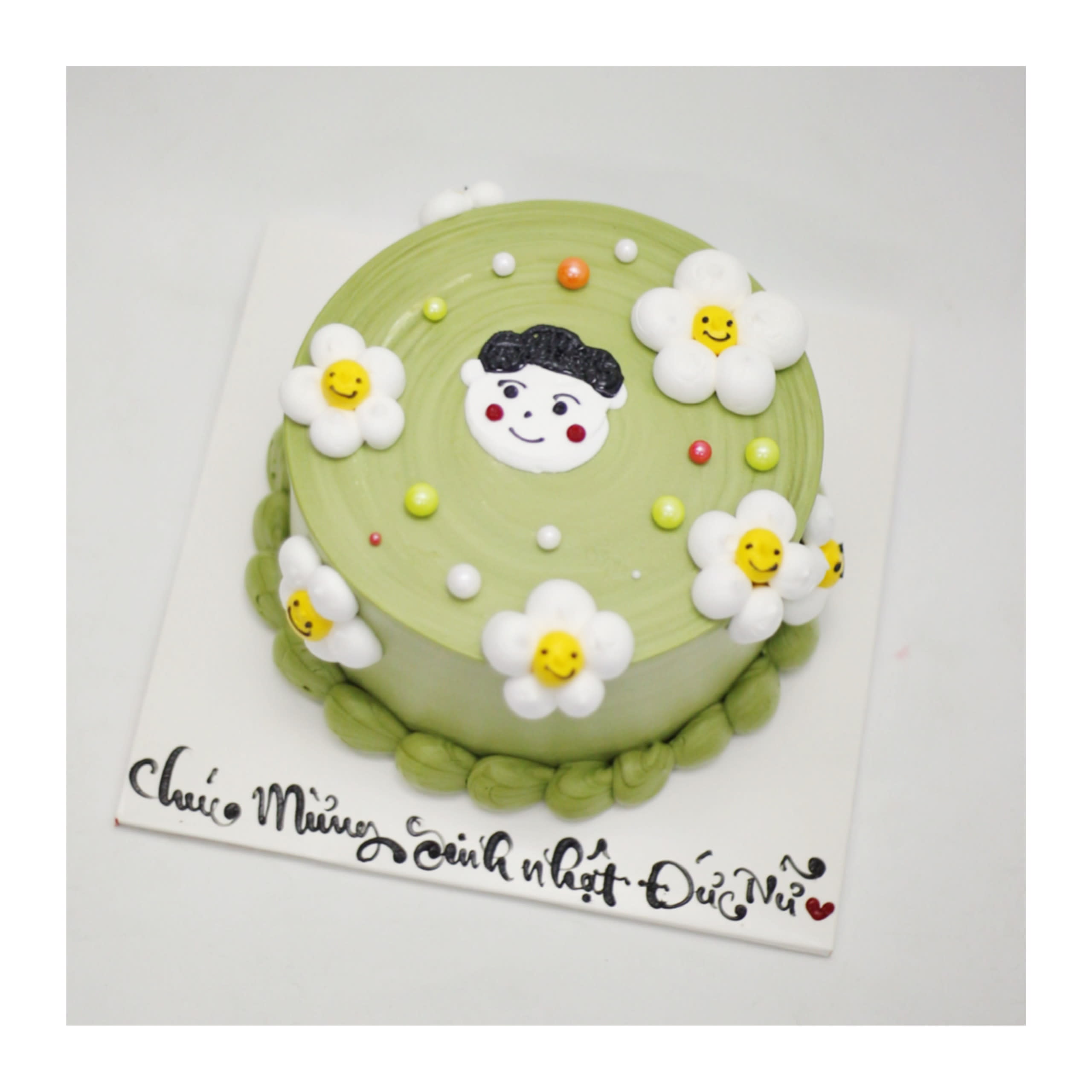 Bánh kem sinh nhật xanh pastel vẽ hình bé
