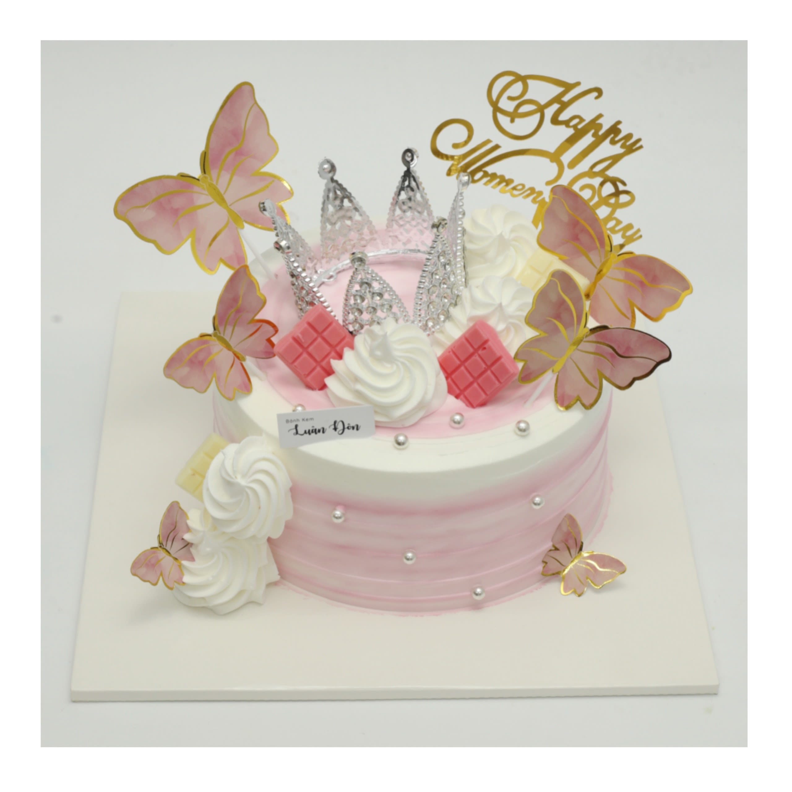Bánh kem màu hồng pastel trang trí vương miện